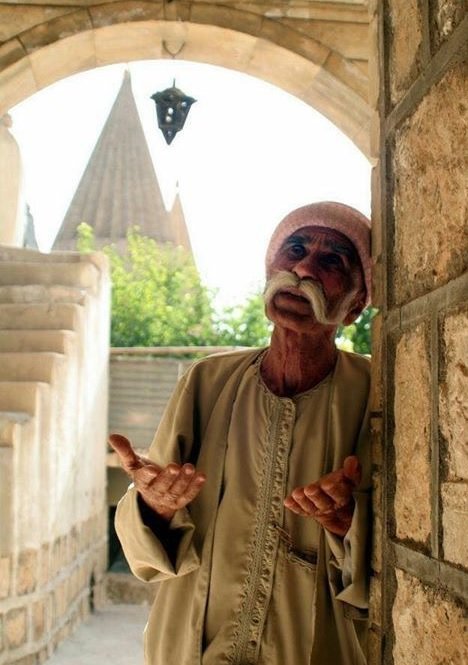 Yazidi man praying