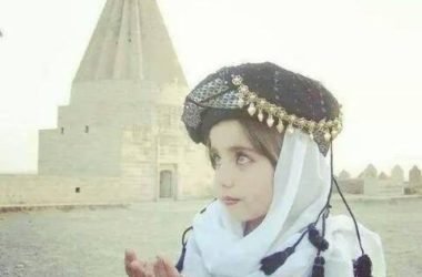 A Yazidi girl praying