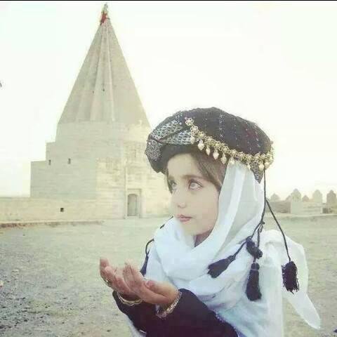 A Yazidi girl praying