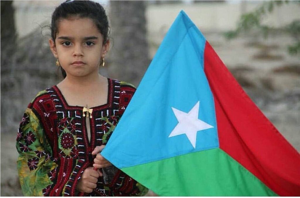 A child waiving the flag of Azad Balochistan