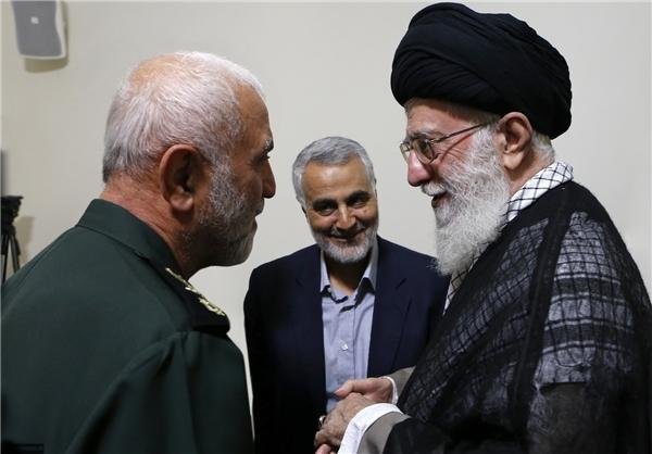 Soleimani’s Curse:  Soleimani with Iran’s Supreme Leader Ali Khamenei and IRGC Brigadier General Hossein Hamedani, Commander of Iranian troops in Syria, killed in Syria on October 8, 2015.