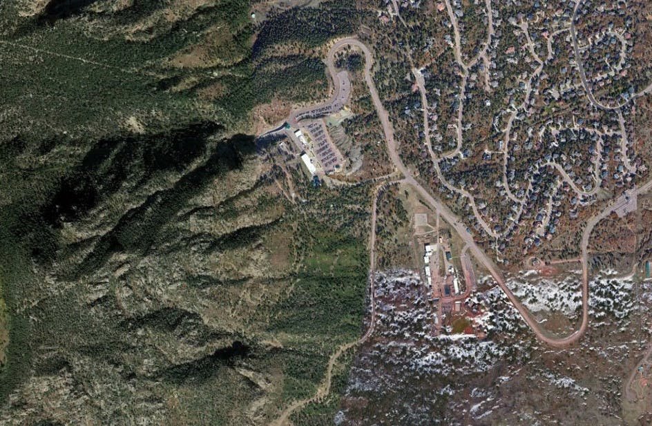 A satellite image of Cheyenne Mountain Air Force Station, with the long snaking road that leads to its main entrance.