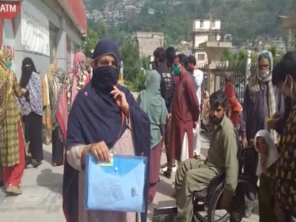 Residents of POK standing in long queues outside the banks for aid, however later to be told that they are not eligible despite meeting all criterion.