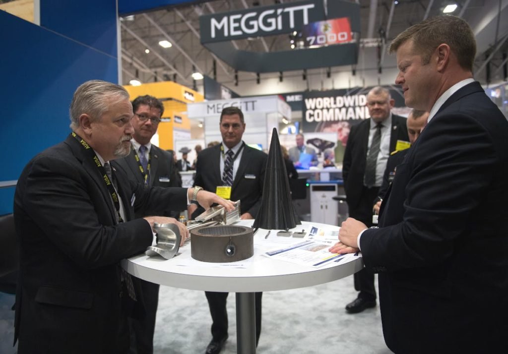 Secretary of the Army Ryan McCarthy at the 2019 Association of the US Army conference and exhibition on Oct. 14, 2019. His right hand is rest on a printout of a Vintage Racer briefing slide.