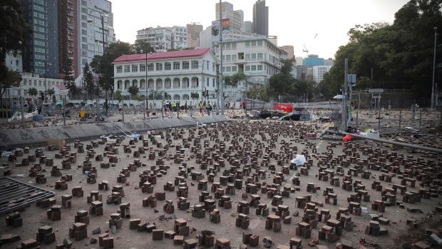Hong Kong Protesters erect barricades with Bricks at the protest sites