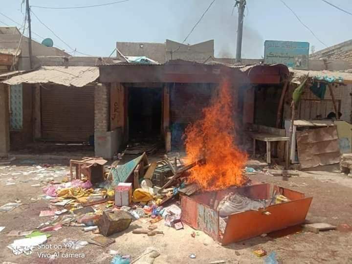 Angry protesters set fire to shops owned by Hindus and burnt tyres on road in Pakistan
