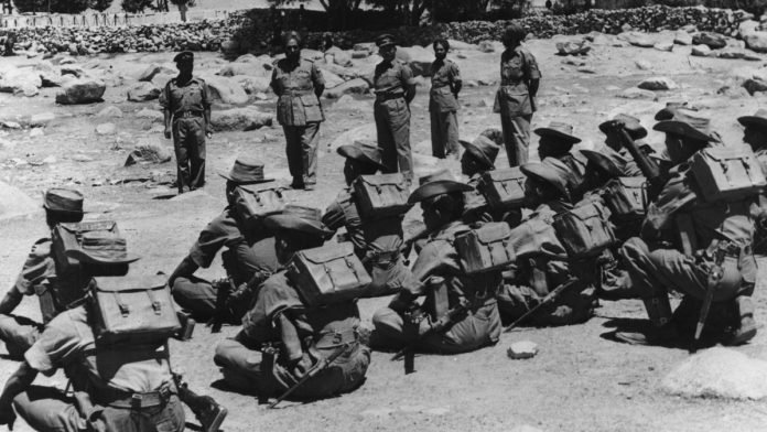 Chinese Aggression at Indian Border: Image of 1962 Indo-China War. Indian Soldiers going to defend Indian borders from the invading Chinese PLA.