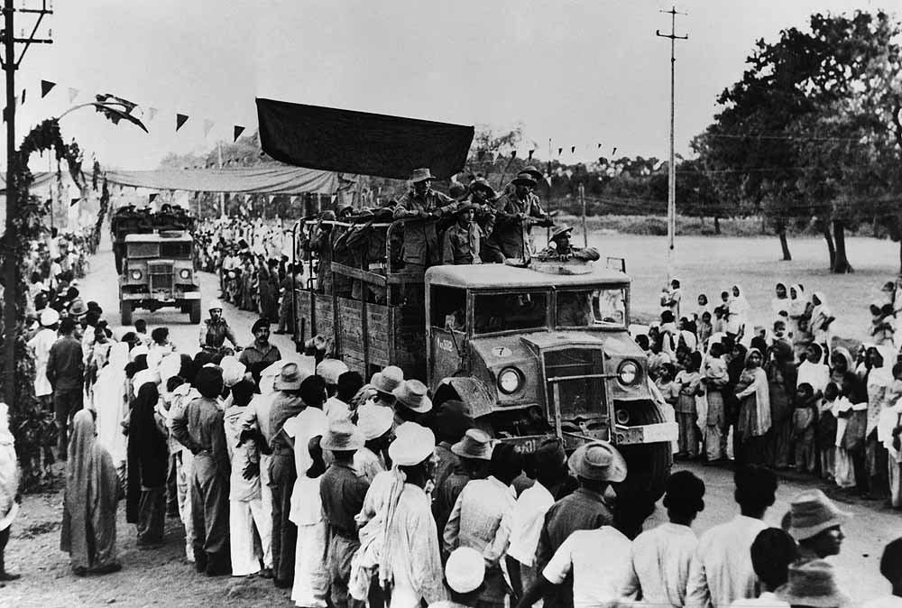 Chinese Aggression at Indian Border: Image of 1962 Indo-China War. Crowds waiving to Indian Soldiers going to defend Indian borders from the invading Chinese PLA. 