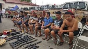 Chinese arrested with illegal arms