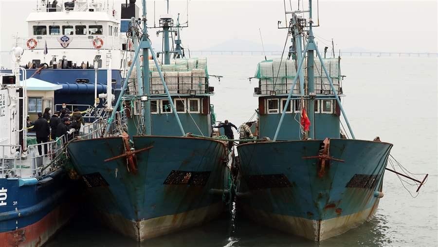 China Stealing Fish Stock Of The World: Flash point of Conflicts: South Korea’s coast guard accused two Chinese vessels of fishing illegally in South Korean waters. No IMO numbers are visible on the hull of either ship.