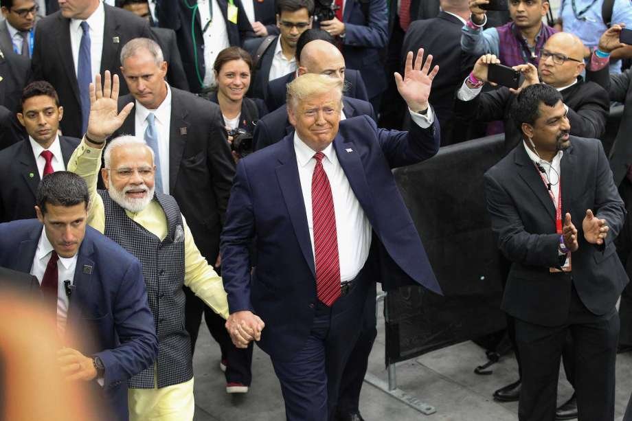 Pakistan degrades to a Nuisance, China is the new Equal: Indian Prime Minister Narendra Modi and US President Donald Trump walk together hand in hand after a rally.