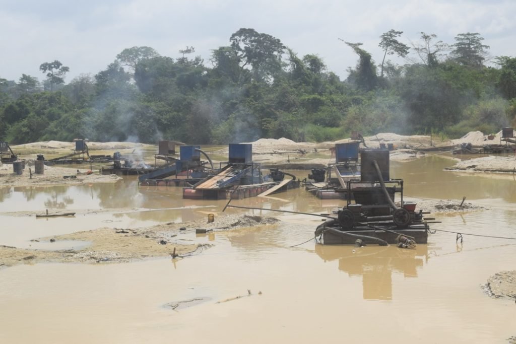 Chinese Debt Trap Diplomacy in Africa : The Case of Ghana - A Report : Chinese illegal Gold Mining activity using heavy equipment