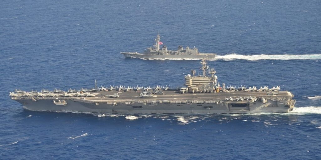 Communist China threatens Democratic Taiwan with Invasion : Will US Protection be sufficient? USS Ronald Reagan (CVN-76) and its strike group in South China Sea