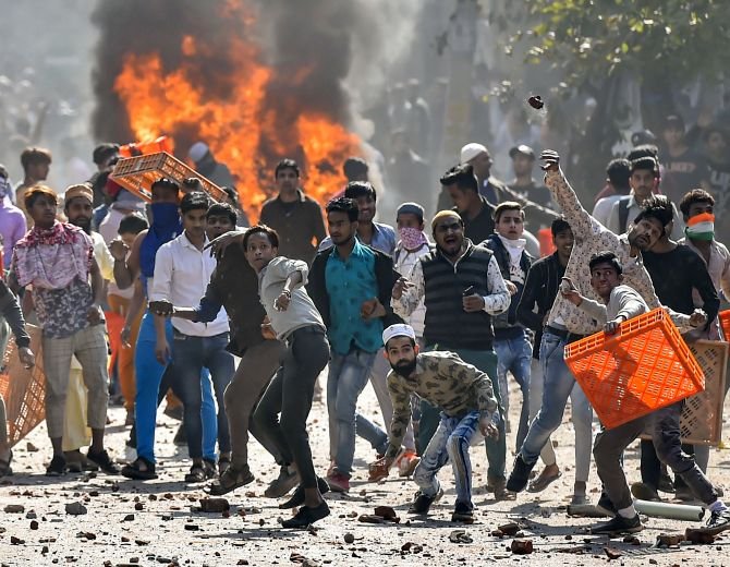 Democracies From US to India Under Attack : Rioters in Delhi attacking police with bricks and stones