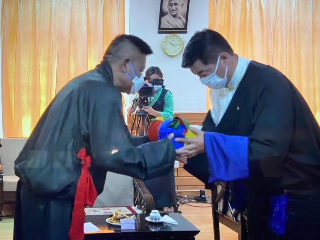 Penpa Tsering Sworn in as the President of the Tibetan Government in-Exile - Outgoing Sikyong Dr Lobsang Sangay handing over the Official Seal of the Kashag to new Sikyong Penpa Tsering, at the swearing-in ceremony, 27 May 2021. | NewsComWorld.com